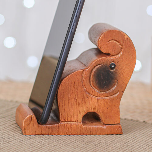 Hand-Carved Brown Elephant Raintree Wood Phone Holder, 'Gentle Assistant' Hand-Carved Brown Elephant Raintree Wood Phone Holder, 'Gentle Assistant'